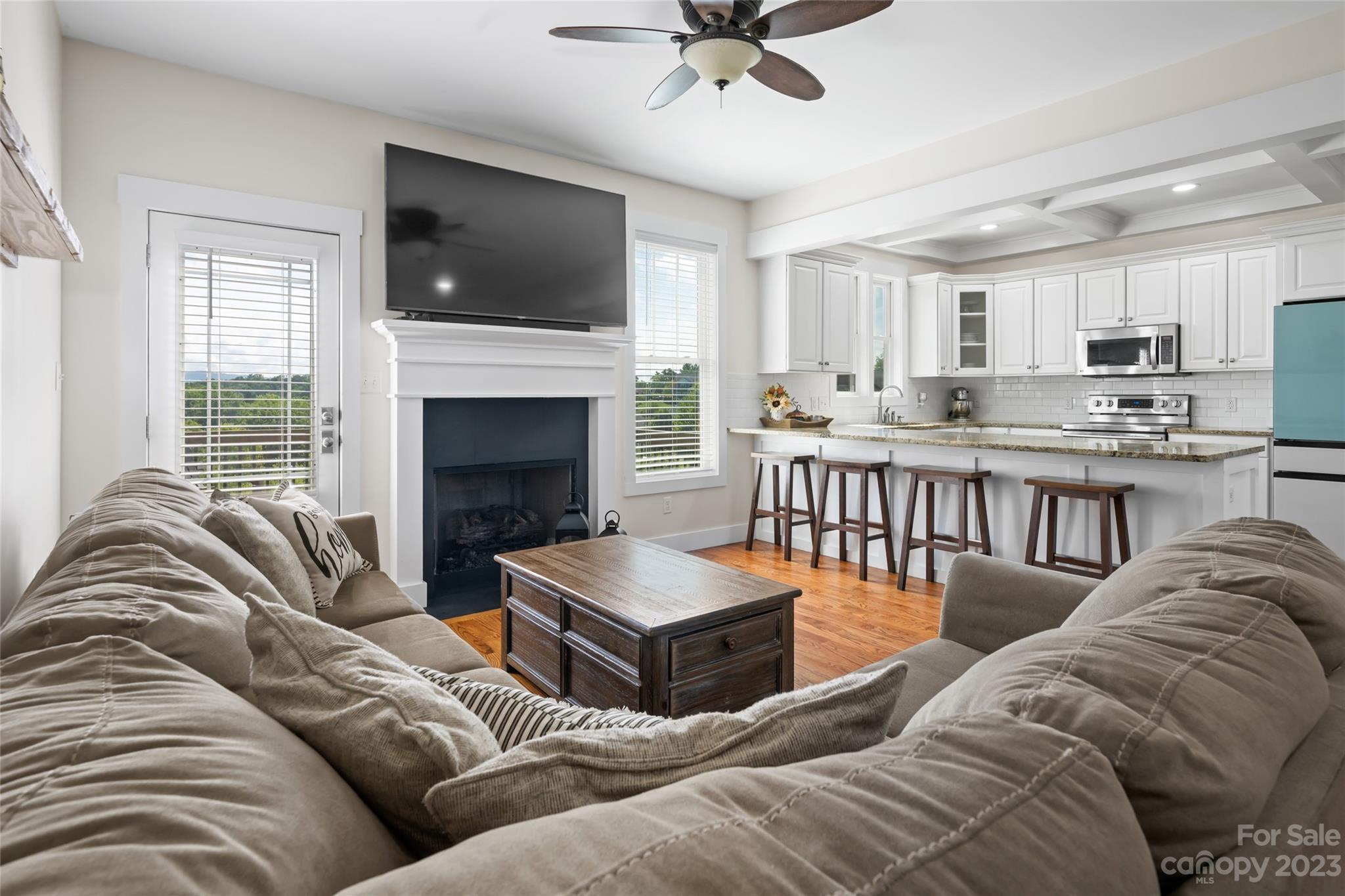 1480 Jenkins Valley Road Alexander, NC 28701 - Photo 12 of 40 a living room with furniture kitchen view and a fireplace