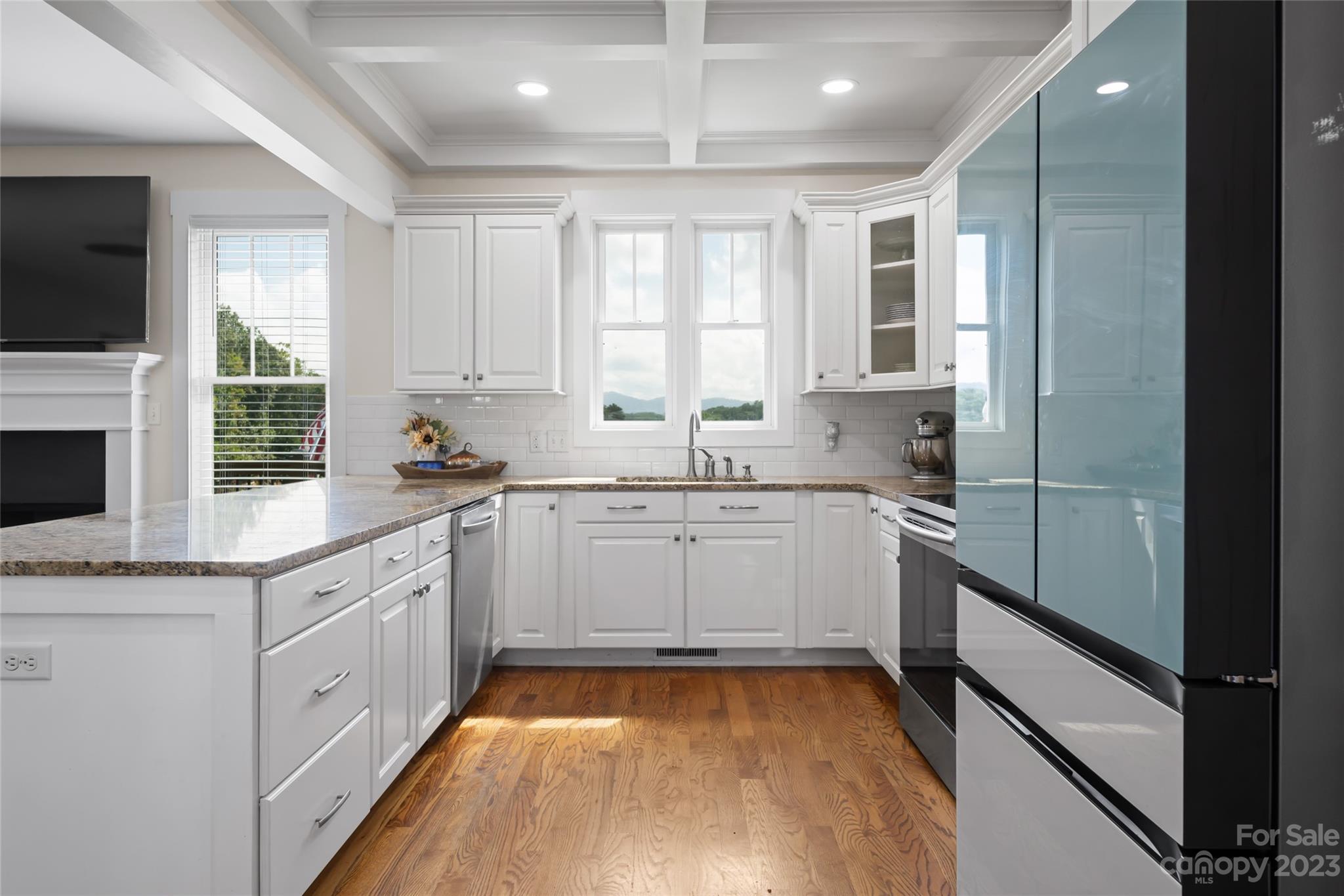 1480 Jenkins Valley Road Alexander, NC 28701 - Photo 14 of 40 a kitchen with a sink window and cabinets