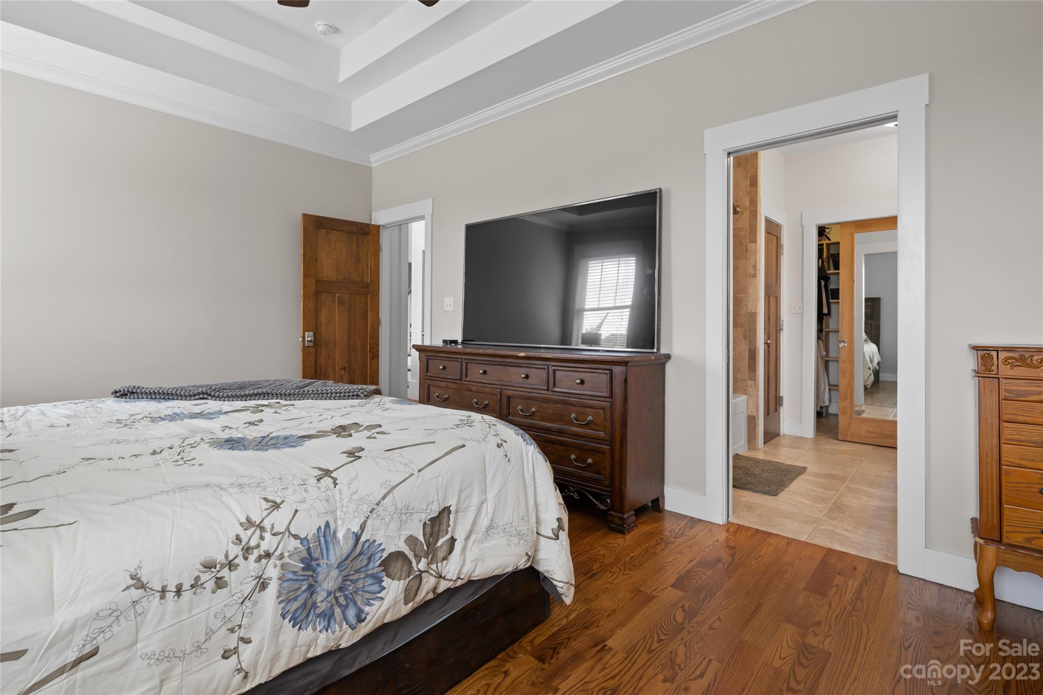 1480 Jenkins Valley Road Alexander, NC 28701 - Photo 17 of 40 a bedroom with a bed and a flat screen tv