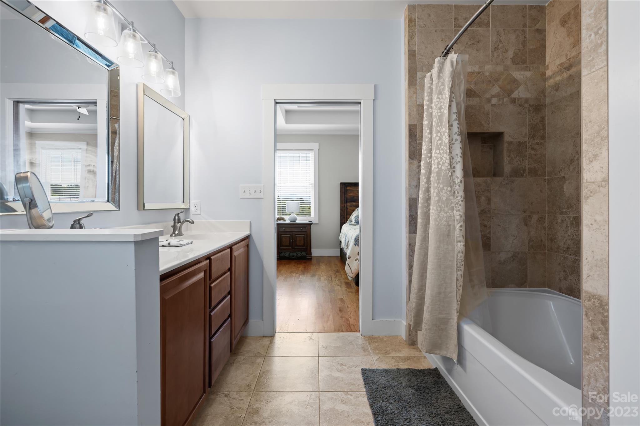 1480 Jenkins Valley Road Alexander, NC 28701 - Photo 19 of 40 a bathroom with a tub sink and mirror