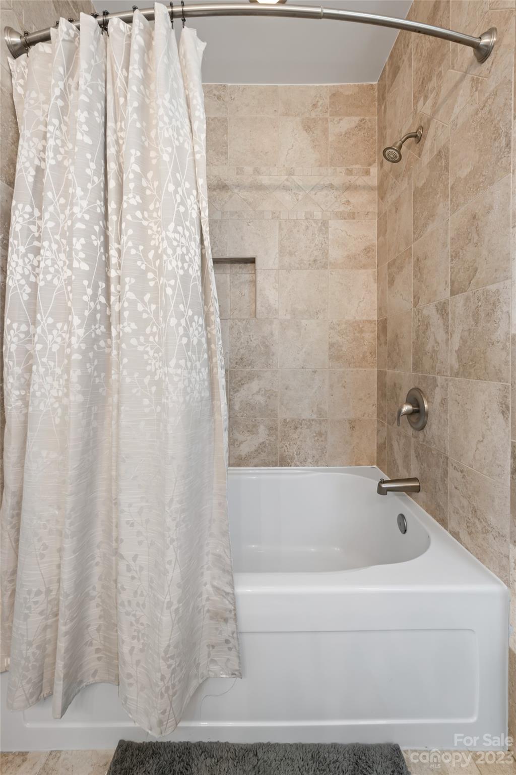 1480 Jenkins Valley Road Alexander, NC 28701 - Photo 20 of 40 a white bath tub and shower curtain