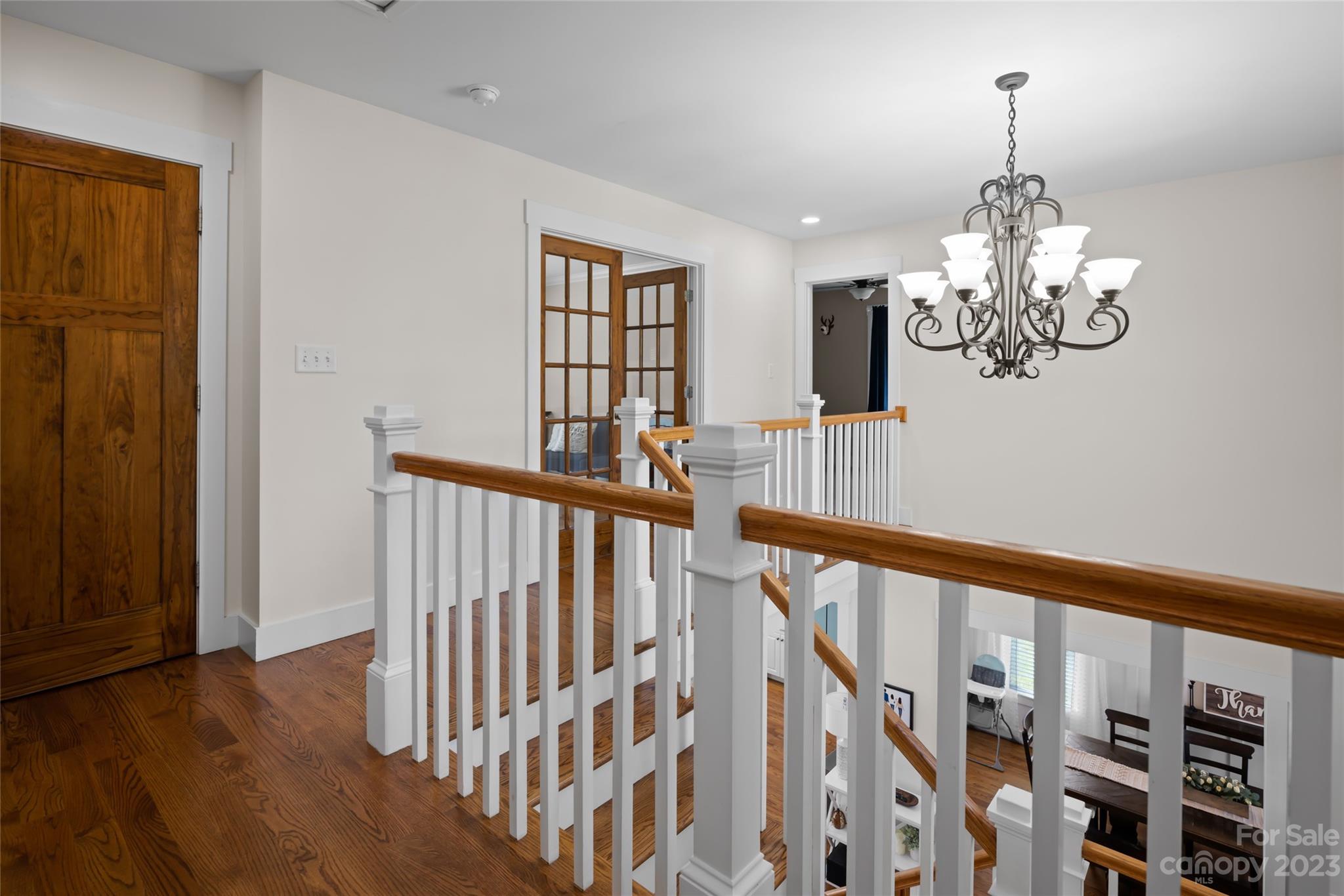 1480 Jenkins Valley Road Alexander, NC 28701 - Photo 23 of 40 a view of a chandelier and wooden floor