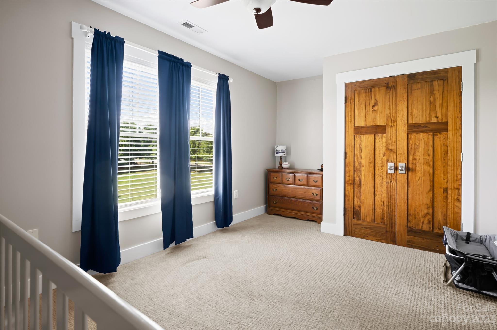 1480 Jenkins Valley Road Alexander, NC 28701 - Photo 28 of 40 a view of a bedroom with a large window and furniture