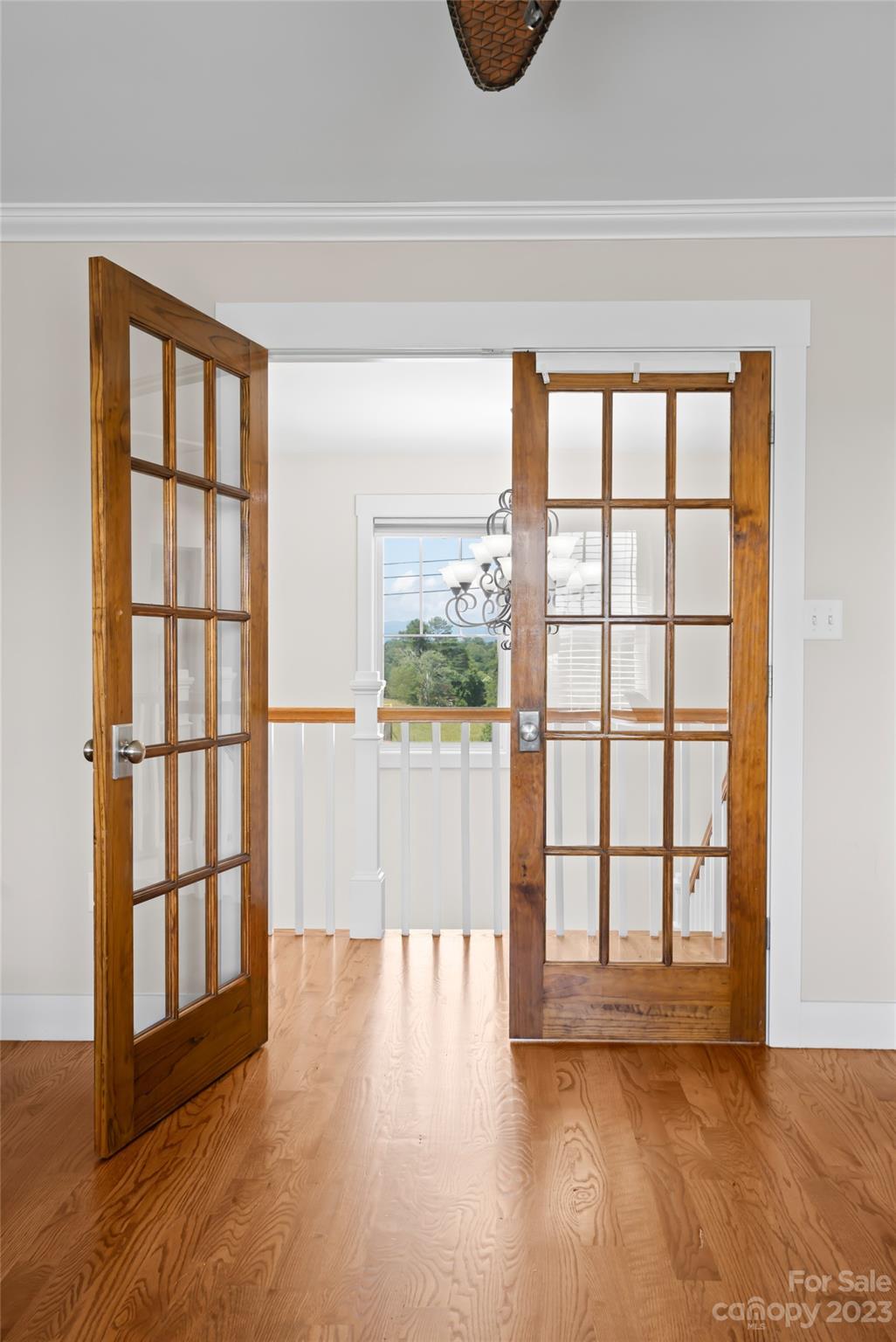 1480 Jenkins Valley Road Alexander, NC 28701 - Photo 29 of 40 a view of empty room with wooden floor and fan