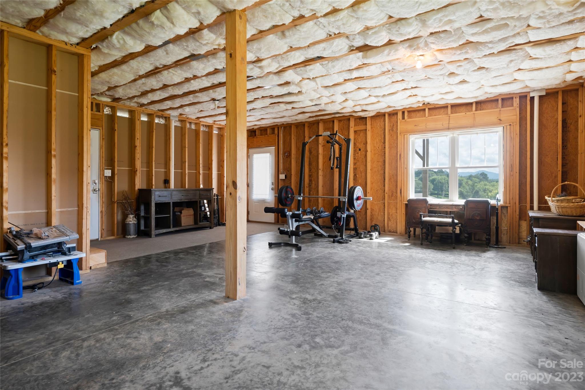 1480 Jenkins Valley Road Alexander, NC 28701 - Photo 35 of 40 a view of a livingroom with furniture and floor to ceiling window