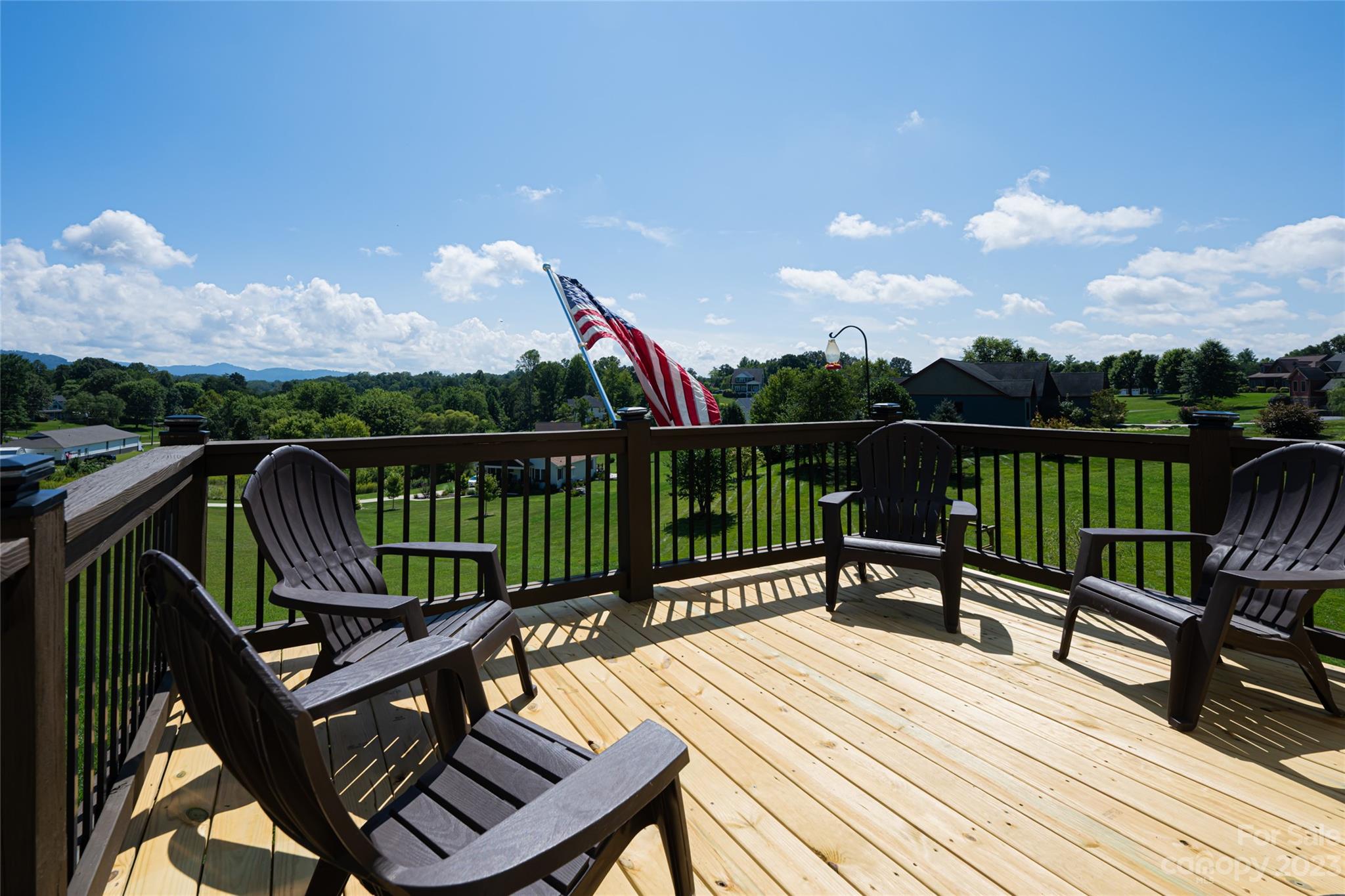 1480 Jenkins Valley Road Alexander, NC 28701 - Photo 39 of 40 a view of a wooden deck with a bench