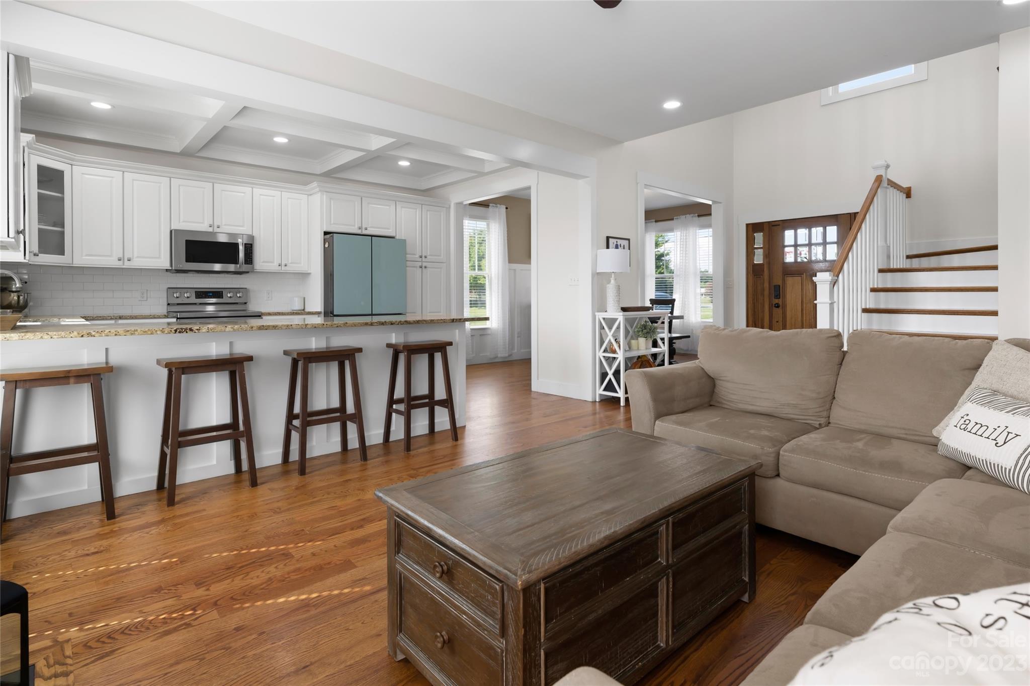 1480 Jenkins Valley Road Alexander, NC 28701 - Photo 8 of 40 a living room with stainless steel appliances kitchen island granite countertop a table chairs and a dining table