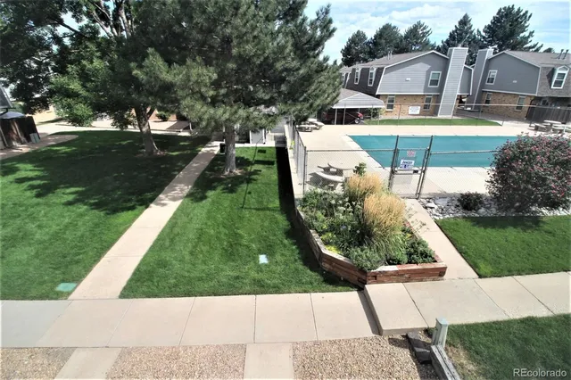 an aerial view of a house with a garden