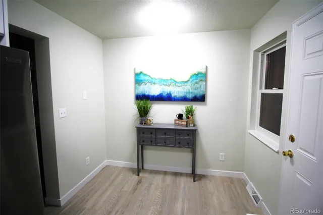 a room with table and potted plant