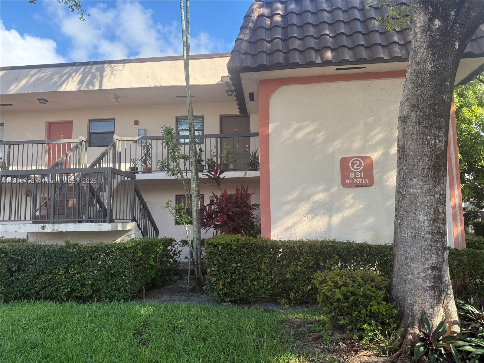 831 Northeast 207th Lane, Unit 2106 Miami, FL 33179 - Photo 1 of 13 a view of outdoor space and yard