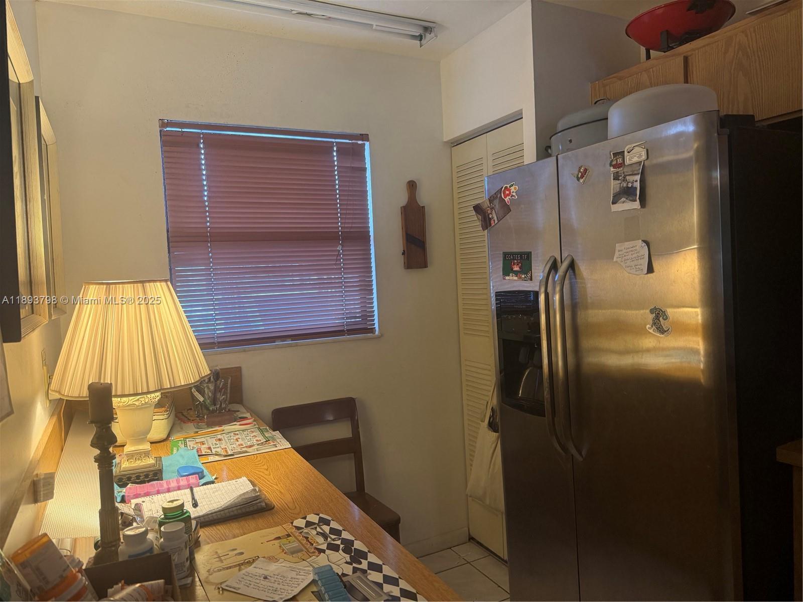 831 Northeast 207th Lane, Unit 2106 Miami, FL 33179 - Photo 8 of 13 a bathroom with a sink and a mirror