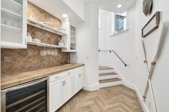 a dining room with furniture and chandelier