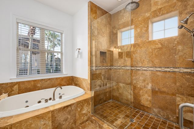 a view of a swimming pool with outdoor seating