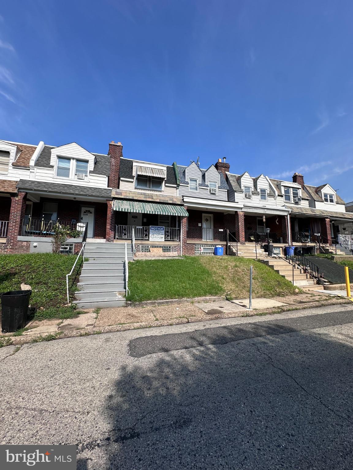 3948 Howland Street Philadelphia, PA 19124 - Photo 7 of 21 Charming row homes under a blue sky.