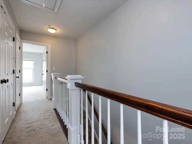 a view of a hallway with a window