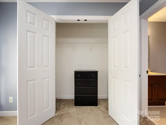 a view of an empty walk in closet