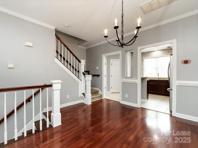 a view of an entryway with wooden floor