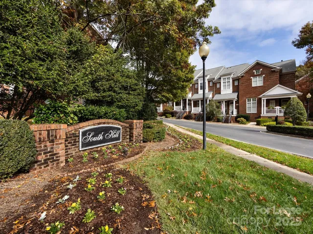 a swimming pool with buildings in the background