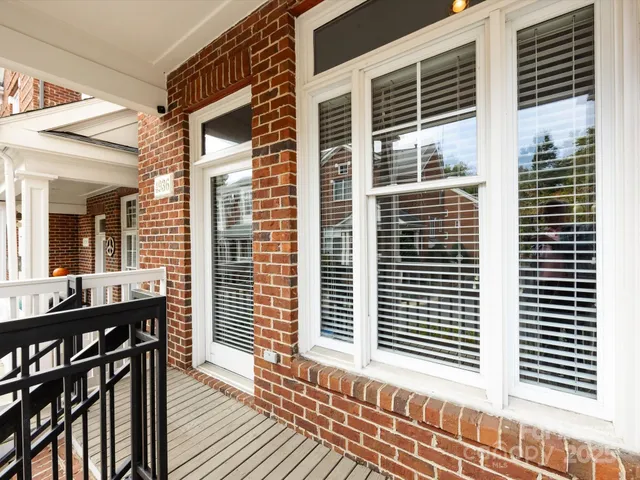a view of a house with a table and chairs