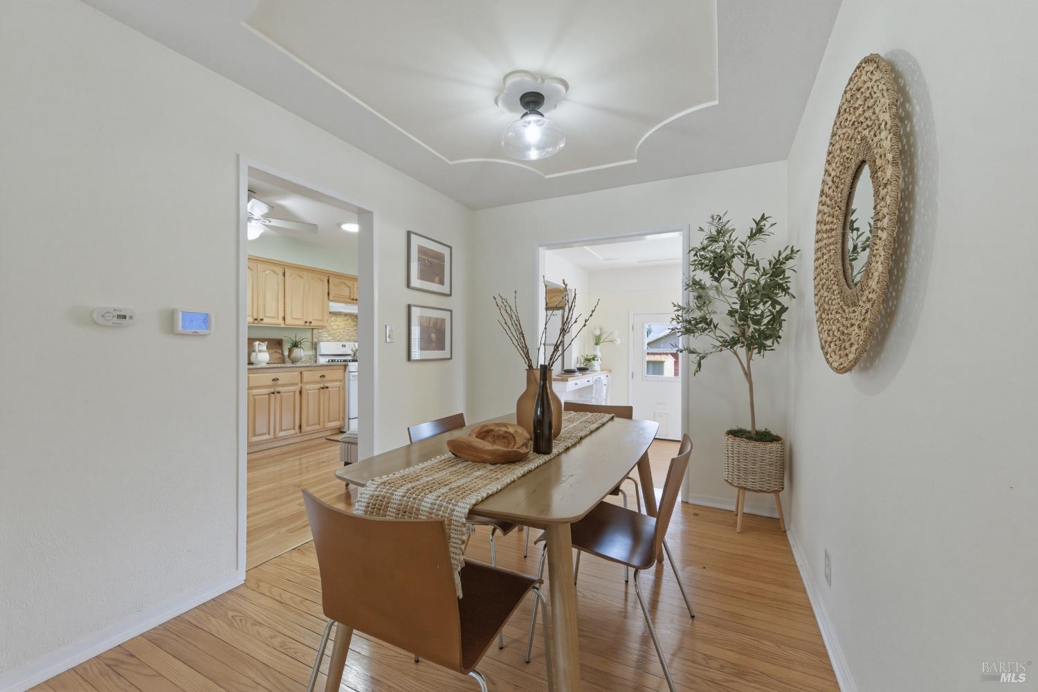 3188 Laurel Street Napa, CA 94558 - Photo 11 of 49 a view of a dining room with furniture and a chandelier
