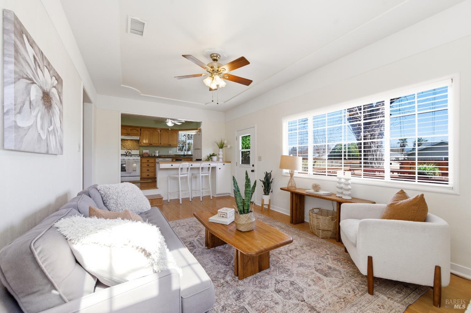 3188 Laurel Street Napa, CA 94558 - Photo 15 of 49 a living room with fireplace furniture and a large window