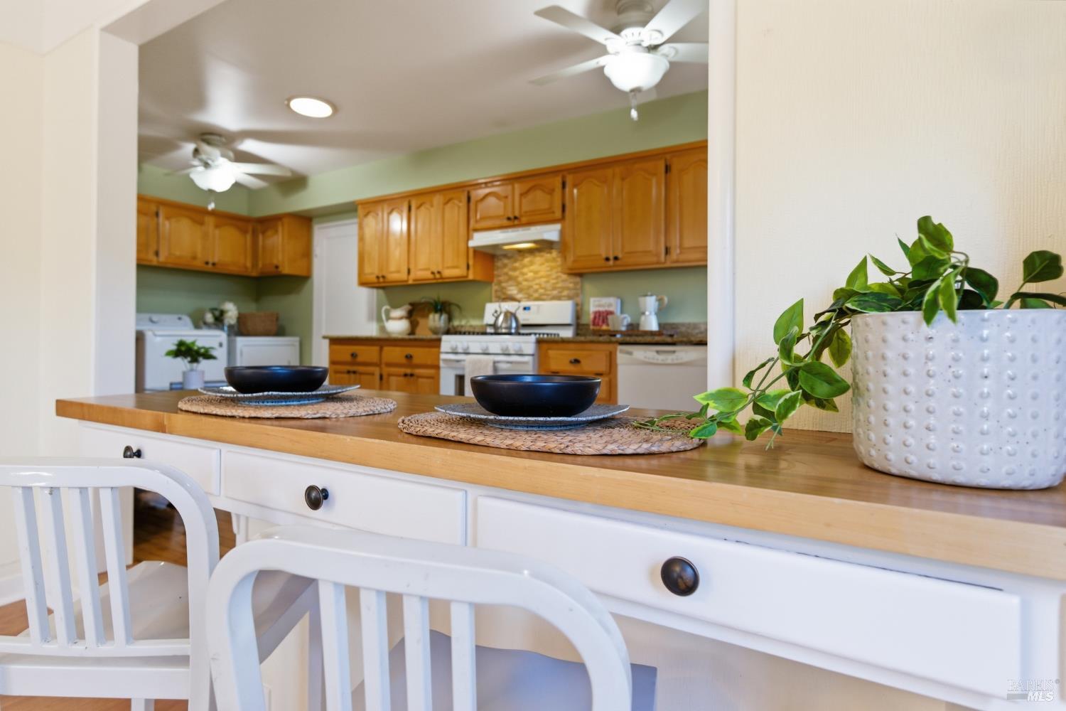 3188 Laurel Street Napa, CA 94558 - Photo 17 of 49 a kitchen with a sink a counter and cabinets