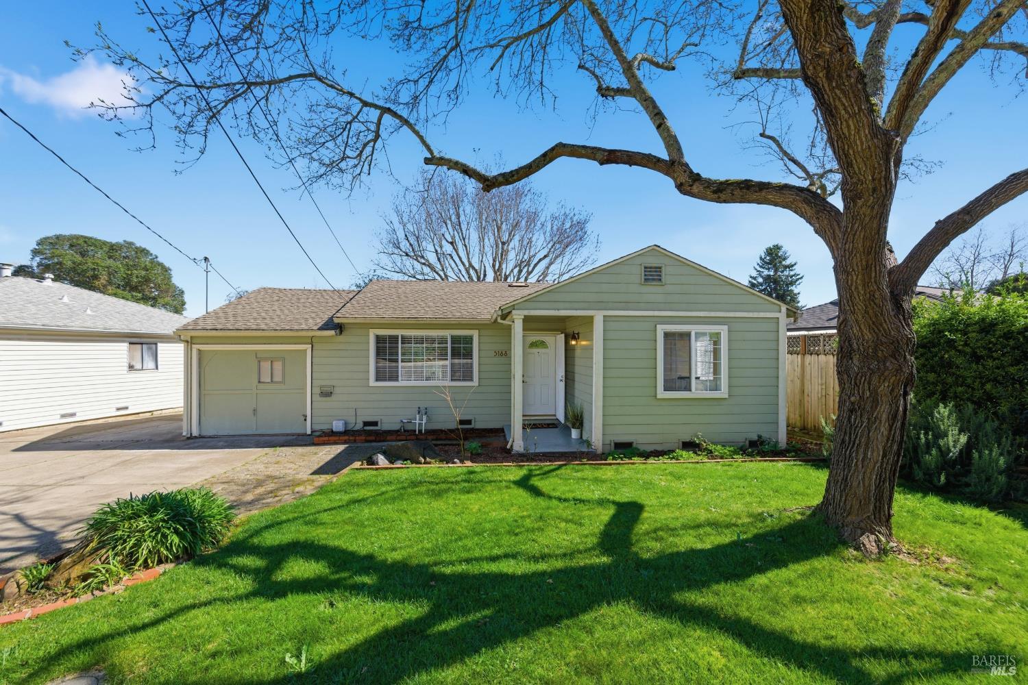 3188 Laurel Street Napa, CA 94558 - Photo 2 of 49 a front view of a house with a yard and garage