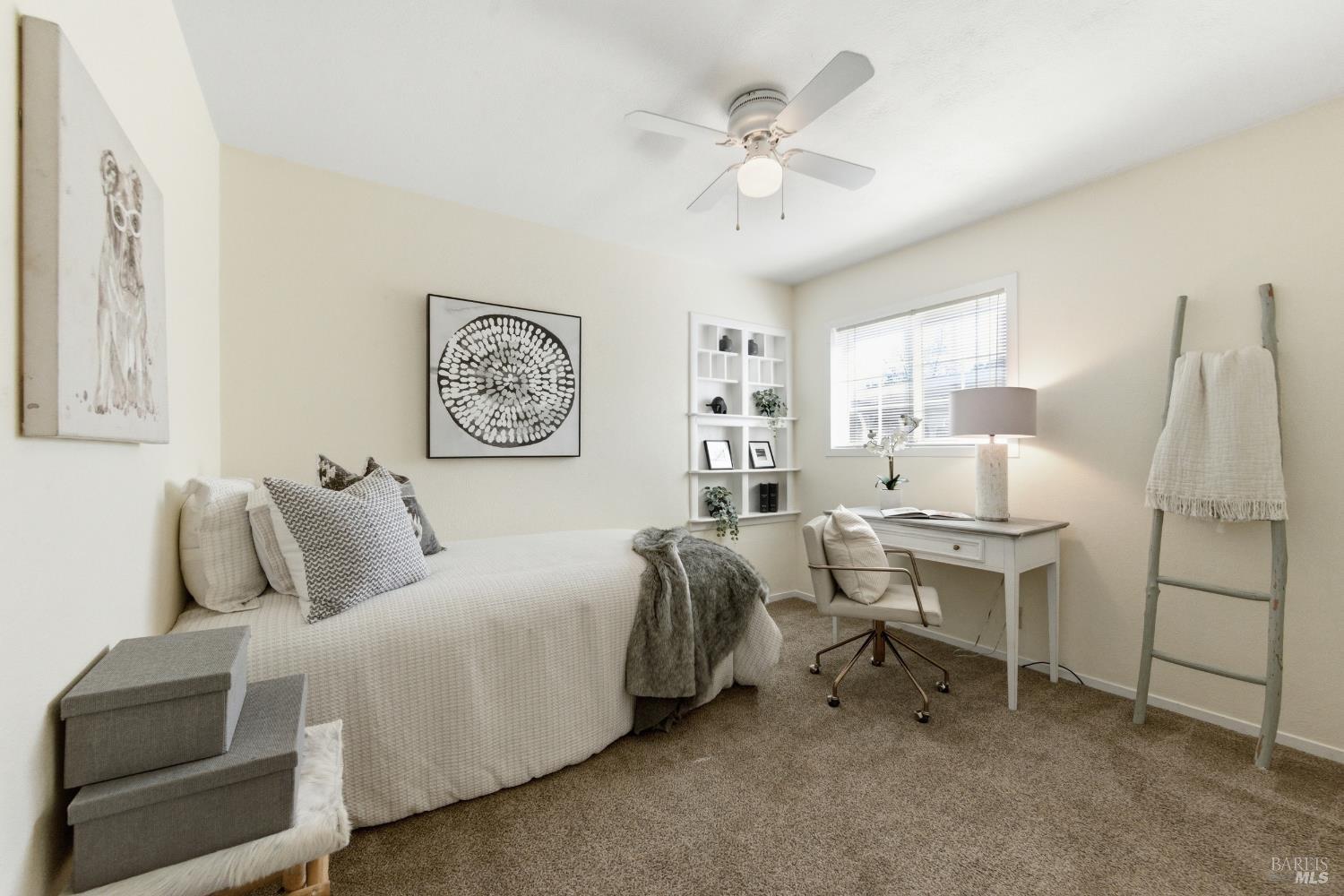 3188 Laurel Street Napa, CA 94558 - Photo 25 of 49 a bedroom with a bed and a chandelier