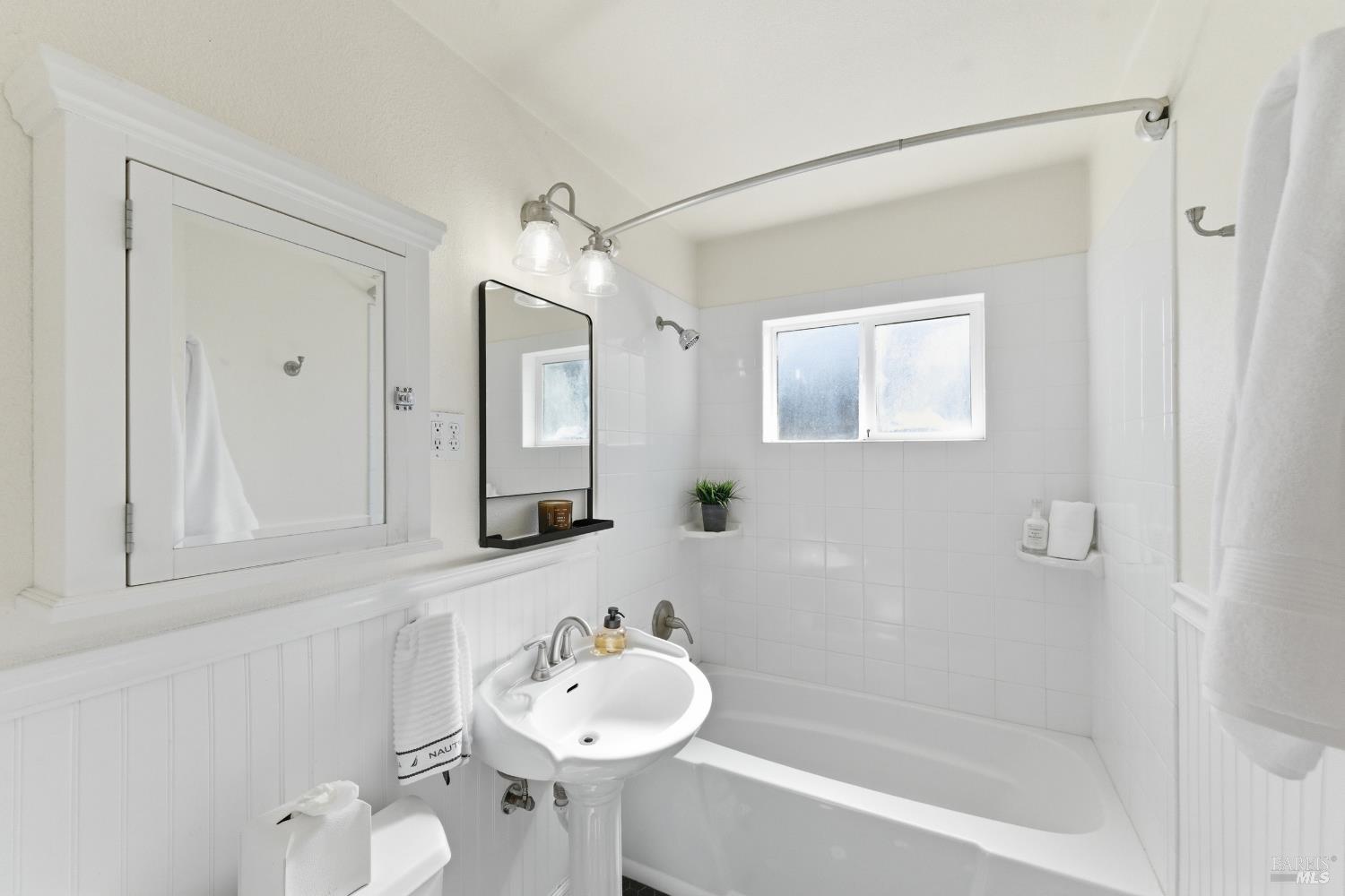 3188 Laurel Street Napa, CA 94558 - Photo 28 of 49 a bathroom with a bathtub shower sink and mirror