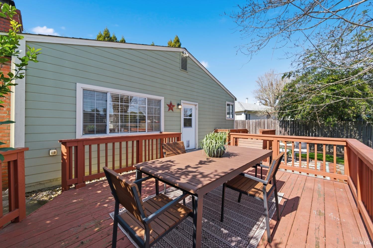 3188 Laurel Street Napa, CA 94558 - Photo 34 of 49 a view of a wooden chairs and table on the deck
