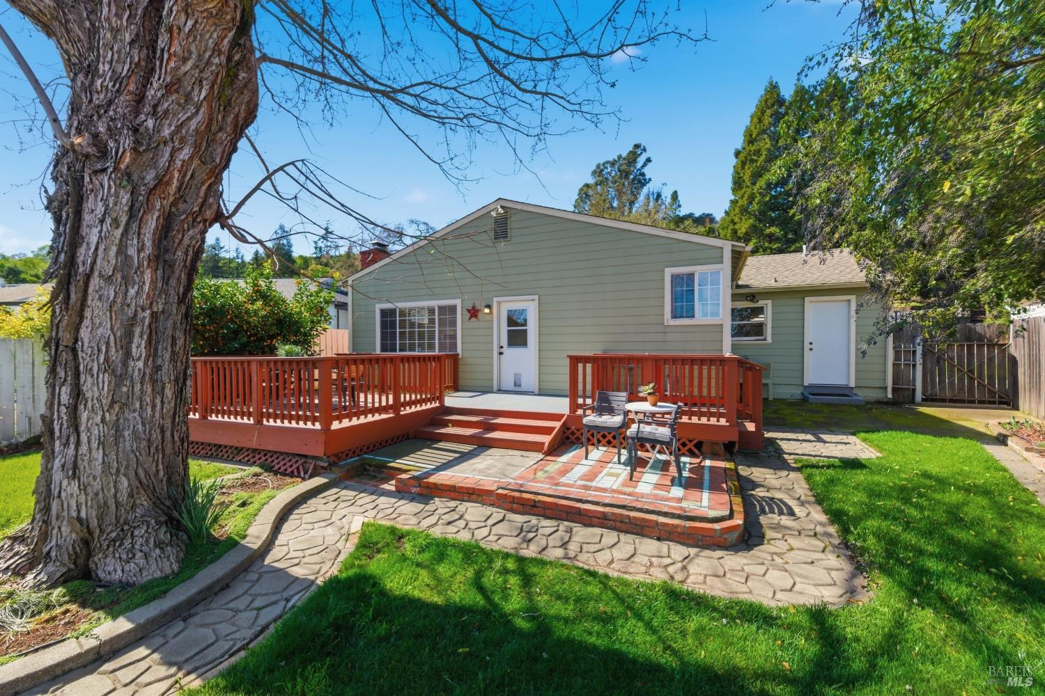 3188 Laurel Street Napa, CA 94558 - Photo 35 of 49 a view of a chair and table in backyard of the house