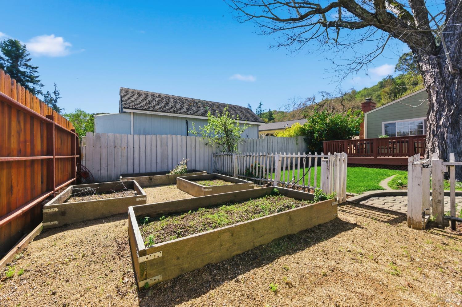 3188 Laurel Street Napa, CA 94558 - Photo 38 of 49 a view of a backyard with couches chair and wooden fence