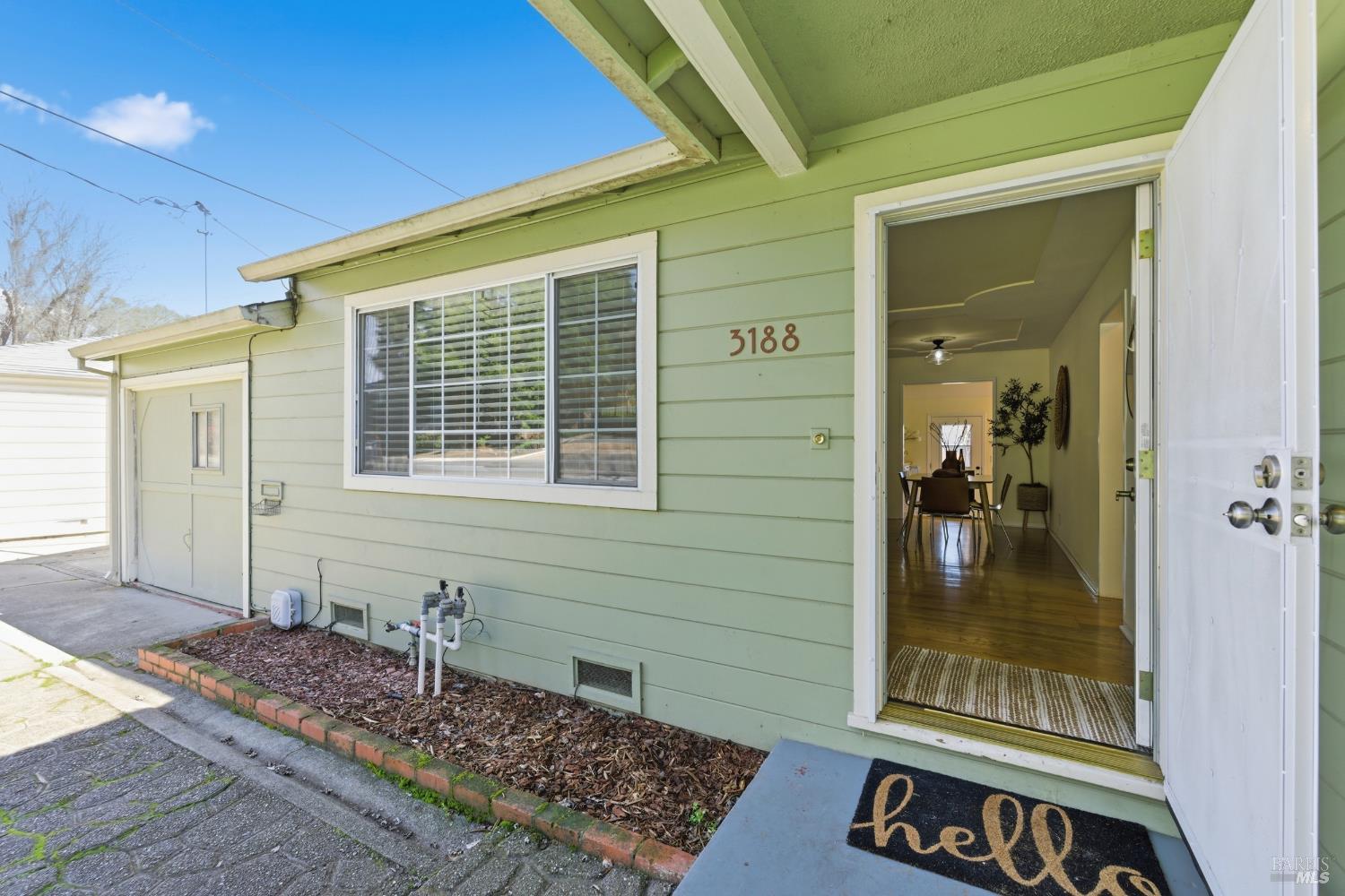 3188 Laurel Street Napa, CA 94558 - Photo 5 of 49 a front view of a house with a glass door