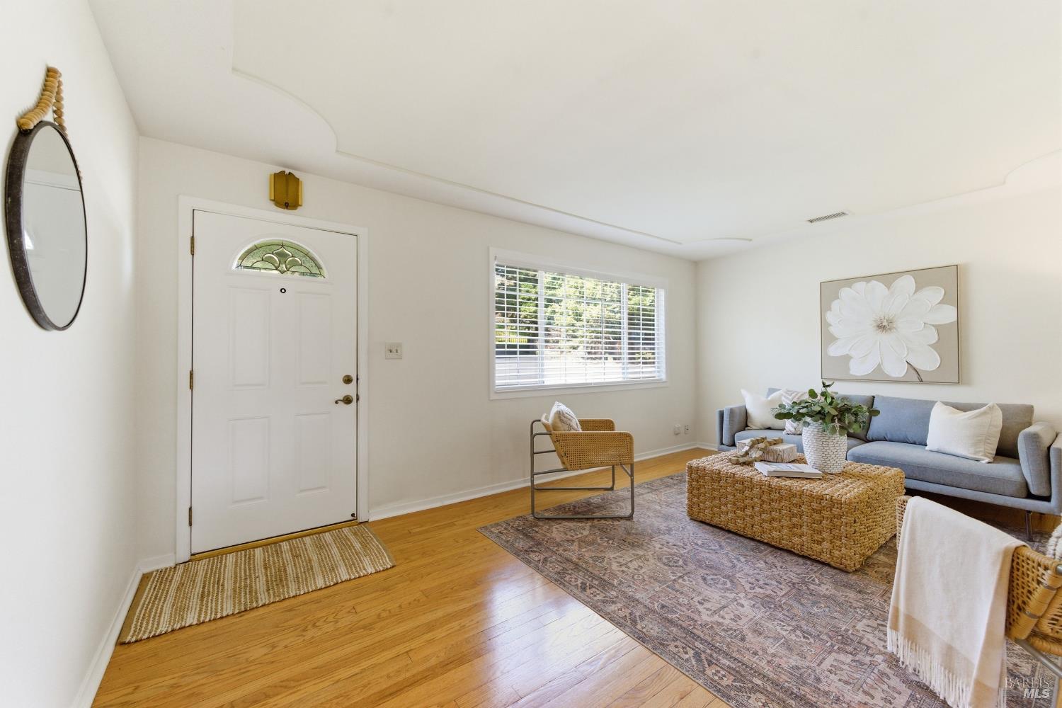 3188 Laurel Street Napa, CA 94558 - Photo 7 of 49 a bedroom with a bed and wooden floor