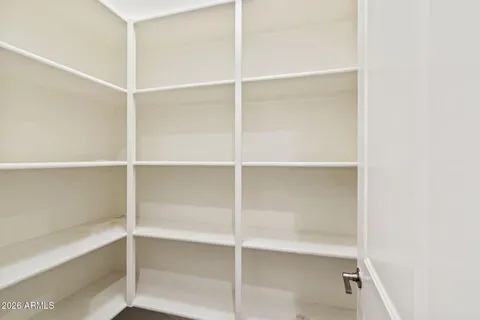 a kitchen with granite countertop a sink stove and cabinets