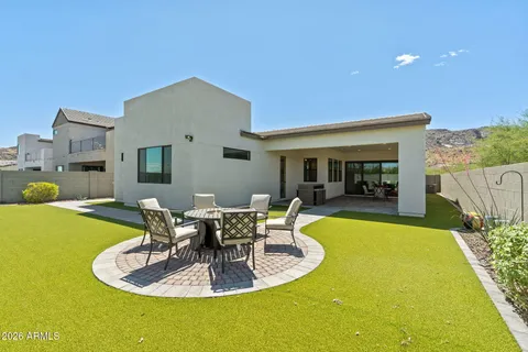 a view of a patio with couches chairs and potted plants