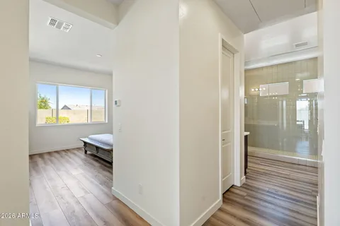 a bedroom with a bed and window