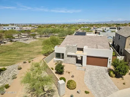 an aerial view of residential houses with outdoor space