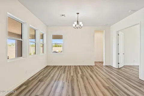 a view of a kitchen with dining space and furniture