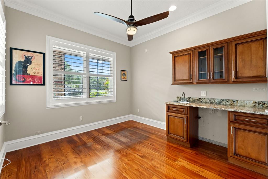 6936 River Road New Port Richey, FL 34652 - Photo 30 of 93 a kitchen with stainless steel appliances granite countertop a stove a sink and a microwave