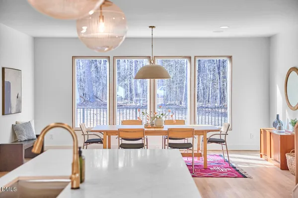 a living room with furniture a window and a table