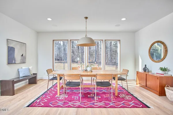 a kitchen with stainless steel appliances granite countertop a lot of counter space and wooden floor