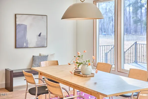 a very nice looking room with wooden floor and a mirror