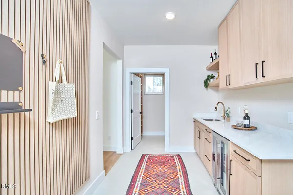 a view of a dining room with furniture and a window