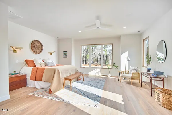 a bedroom with bed and a book shelf