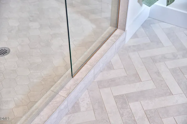 a view of an empty room with windows