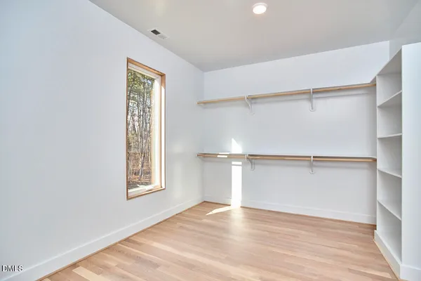 a house that has a tree in front of it