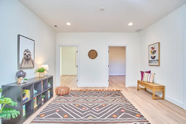 a large house with a large tree and yard