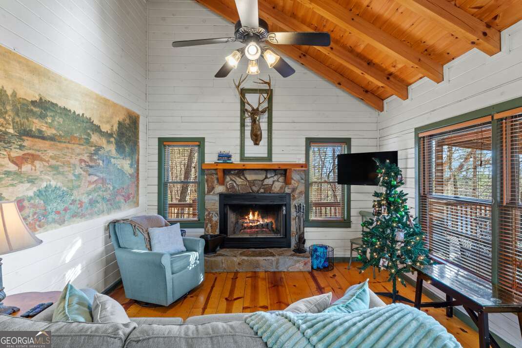 100 Smith Hill Road Blue Ridge, GA 30513 - Photo 13 of 66 a living room with furniture and a fireplace