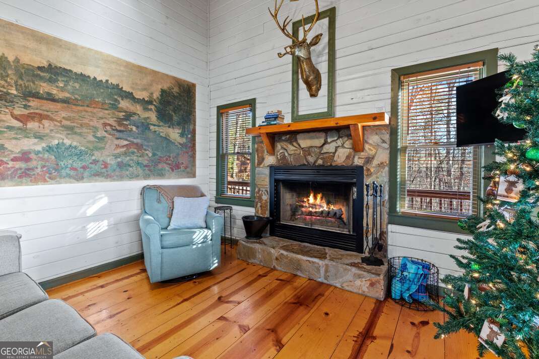 100 Smith Hill Road Blue Ridge, GA 30513 - Photo 14 of 66 a living room with furniture and a fireplace
